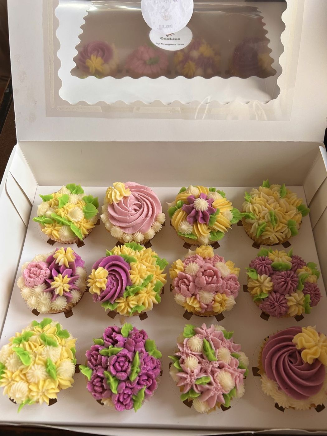 Vanilla cupcakes decorated with buttercream flowers
